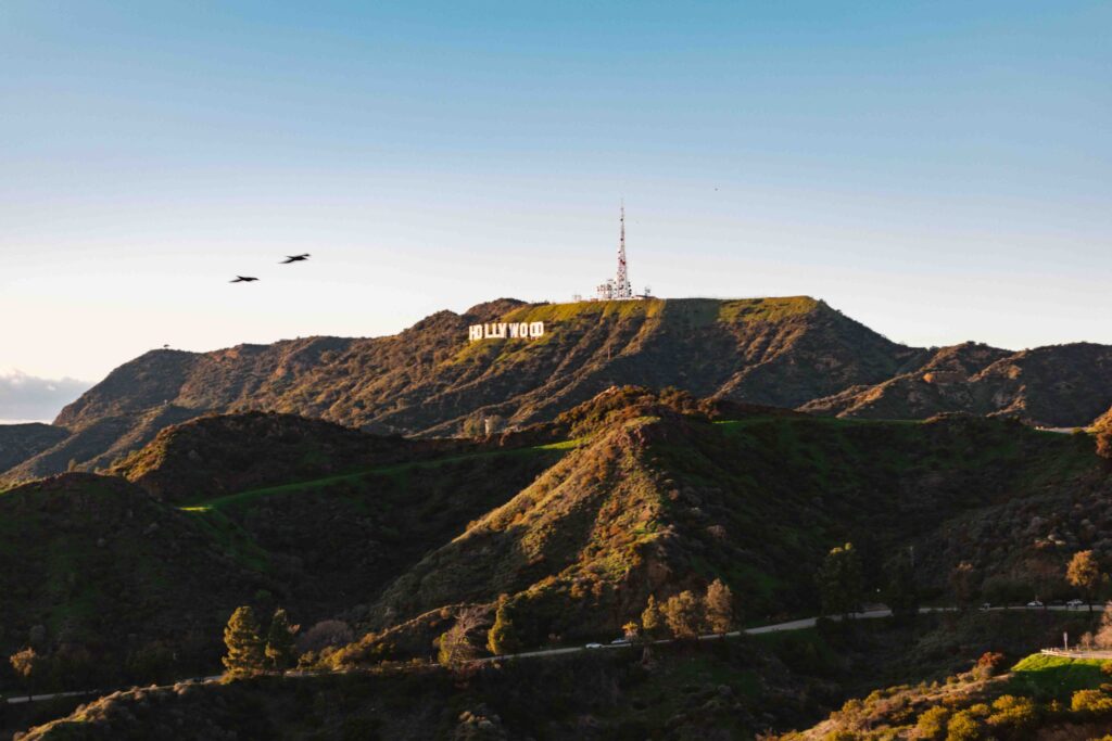 Sunset view of the Hollywood Sign on the rolling golden hills of Los Angeles