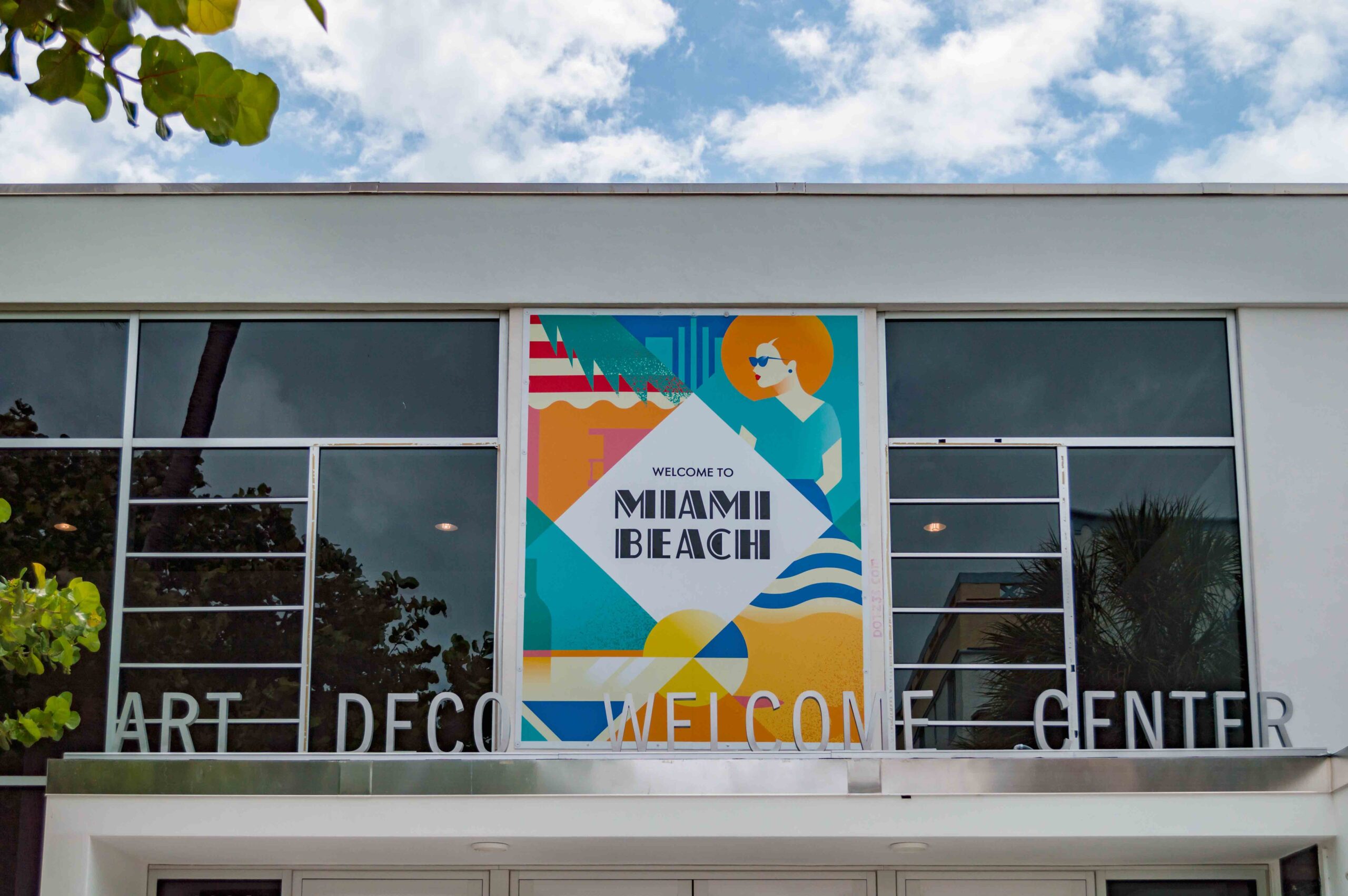 front of the art deco welcome center in miami beach, florida