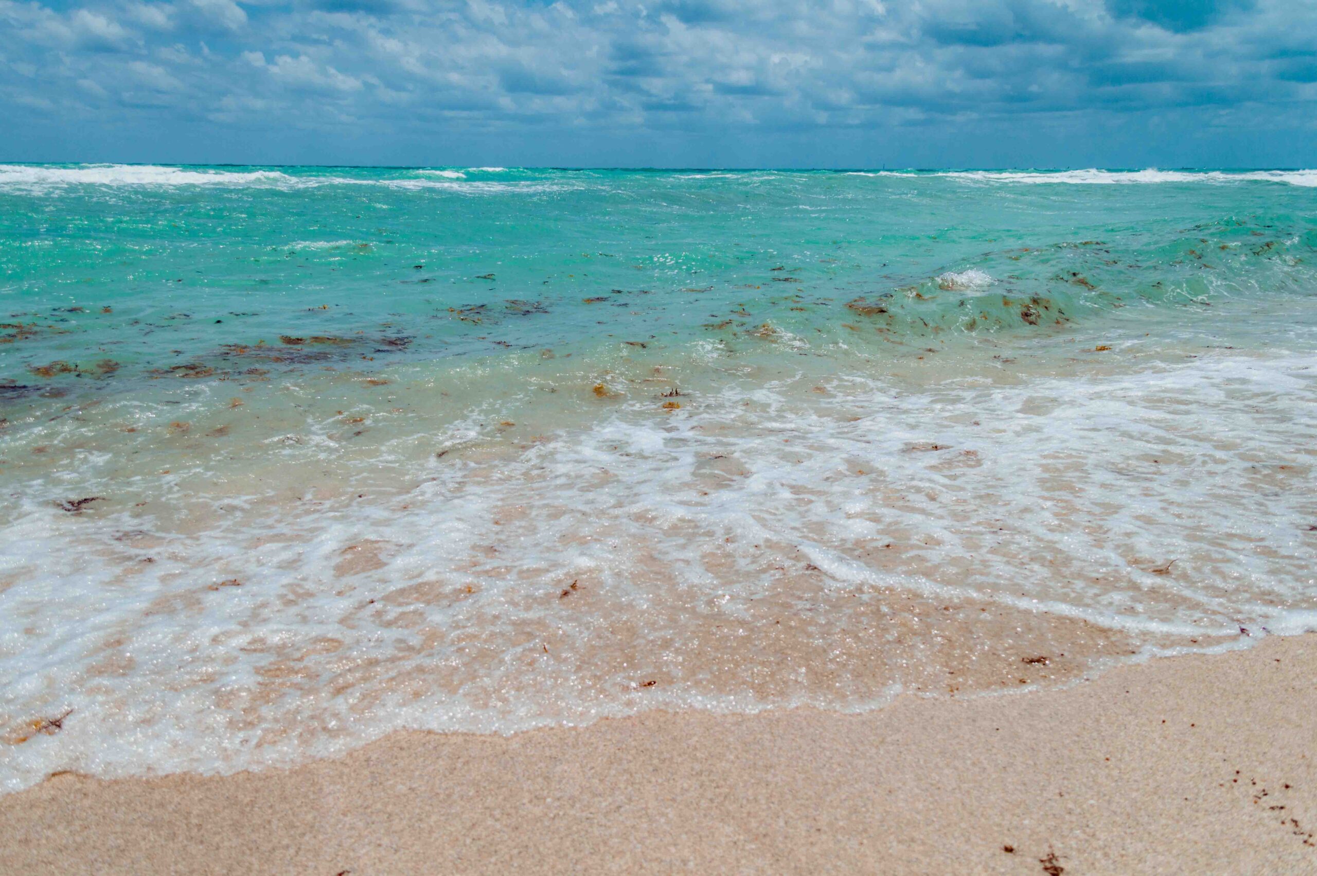beach along South Florida coastline with turquoise water and picture perfect waves