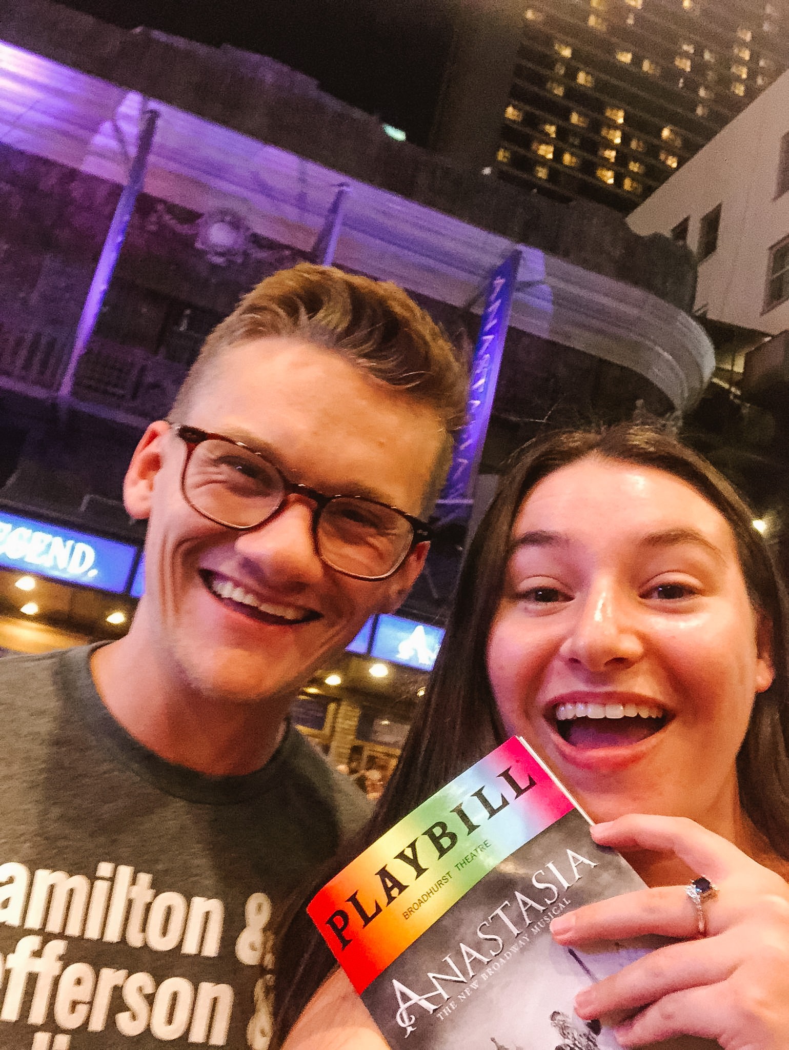 Girl and her friend in front of the Broadway theater holding the Playbill for Anastasia