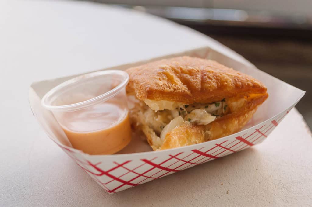 Savory crab beignet with remoulade sauce on the side