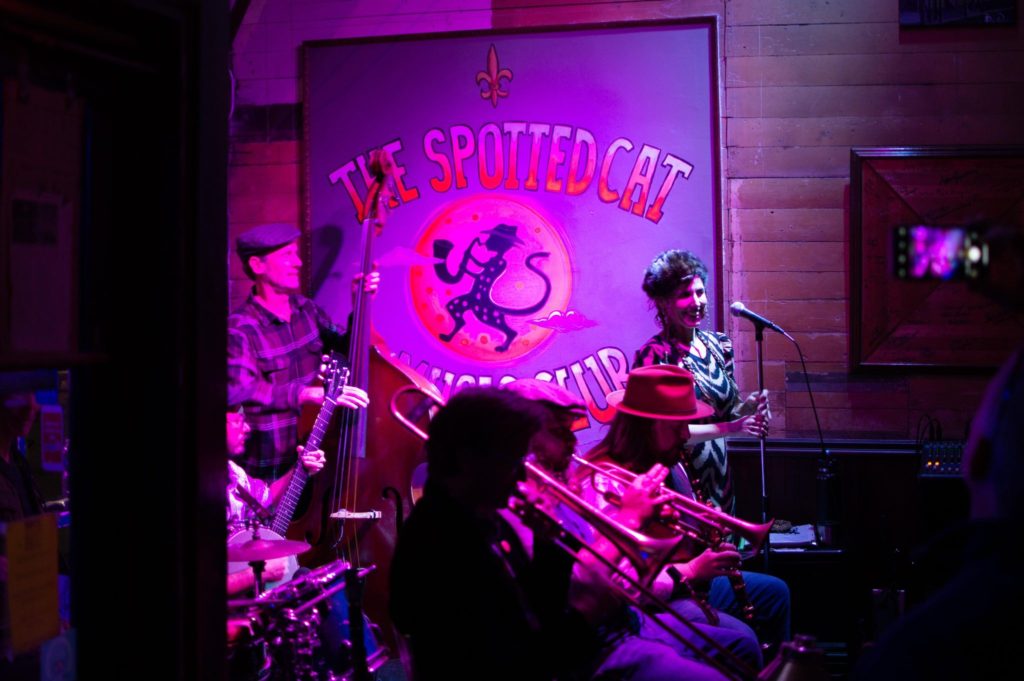view of a jazz band on stage with purple lighting.