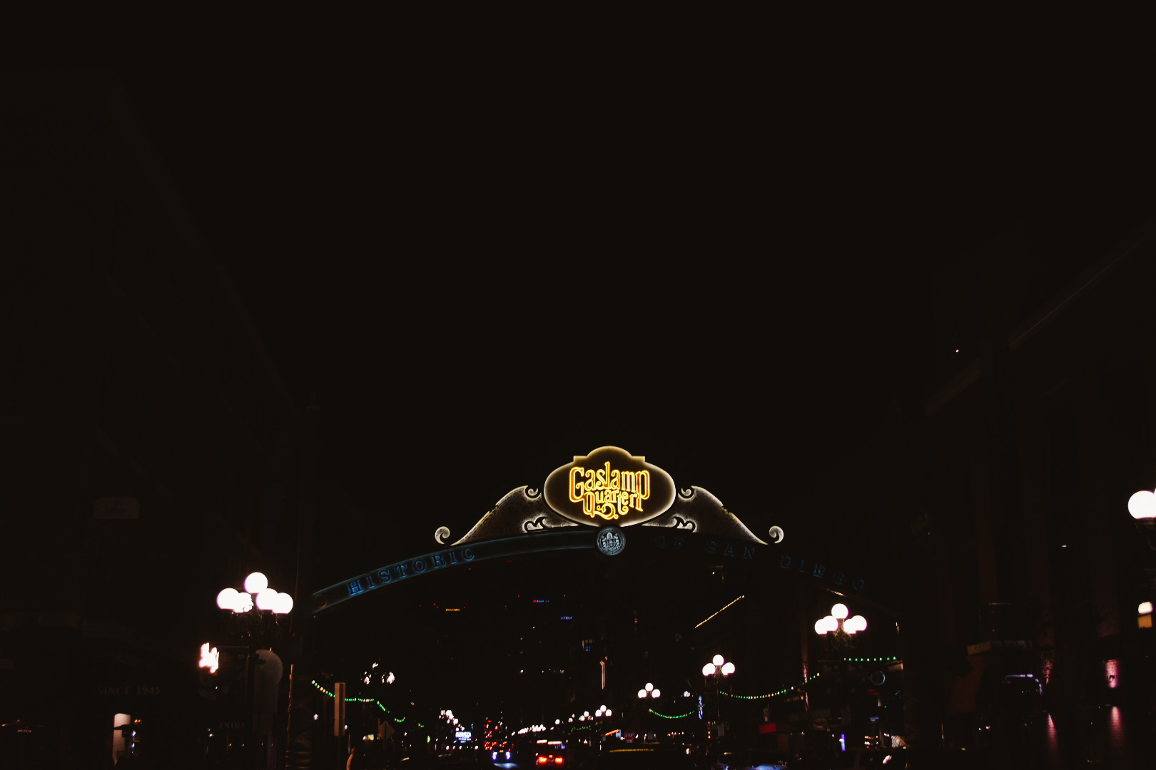 Gaslamp Quarter neon sign arched over the street at night