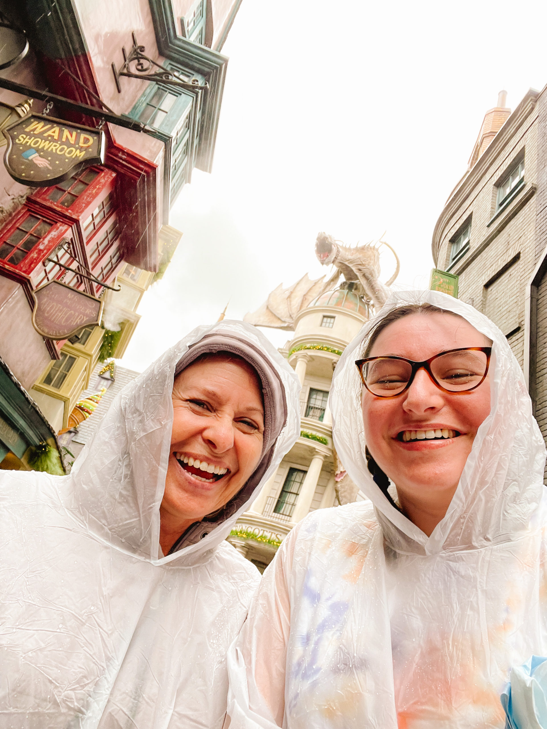 mother daughter duo in Harry Potter world Orlando in the rain
