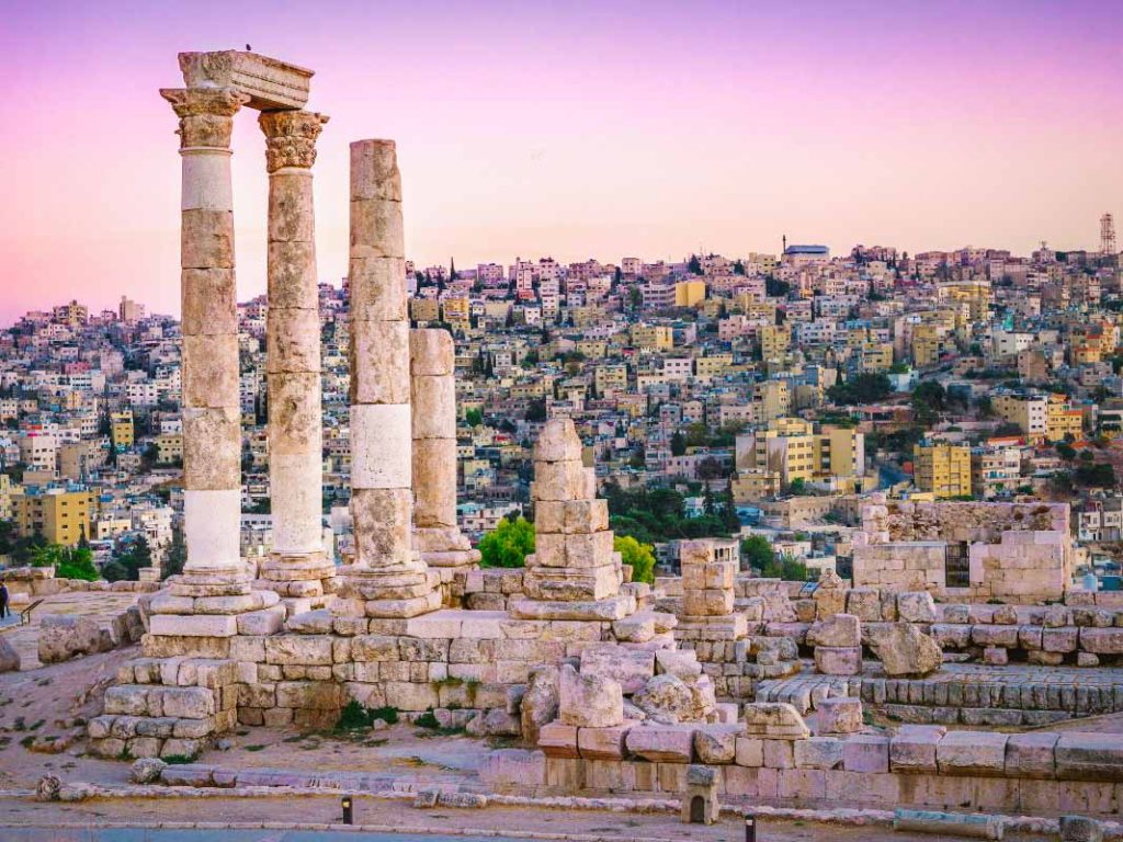 View of ruins in Amman, Jordan with cityscape in the background