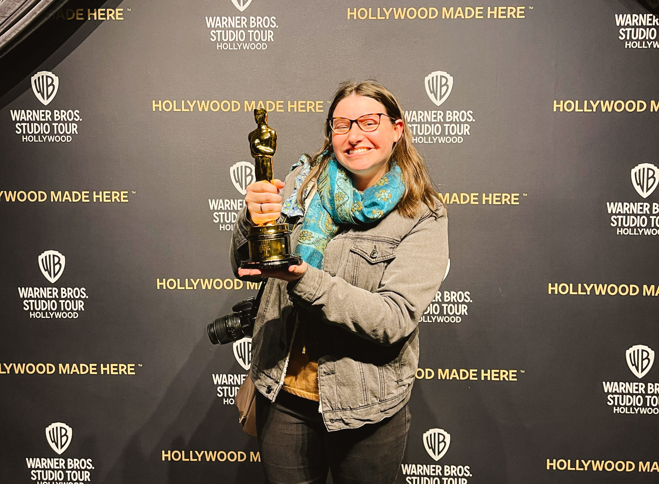 Woman holding an Academy Award Oscar at Warner Brothers Studio Tour in Burbank California