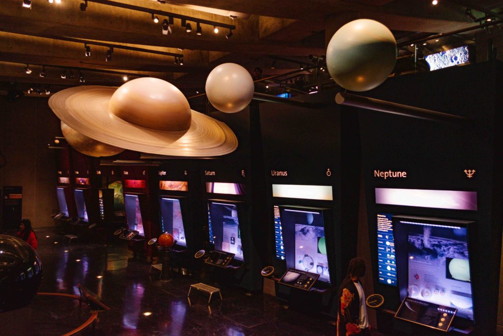 Hall of Planets in Griffith Observatory with large scale planet models hanging from ceiling
