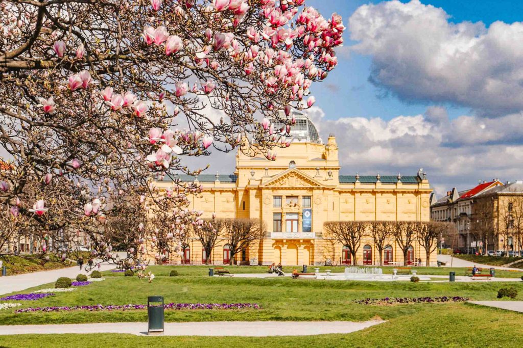 Zagreb Croatia square with cherry blossoms in the foreground