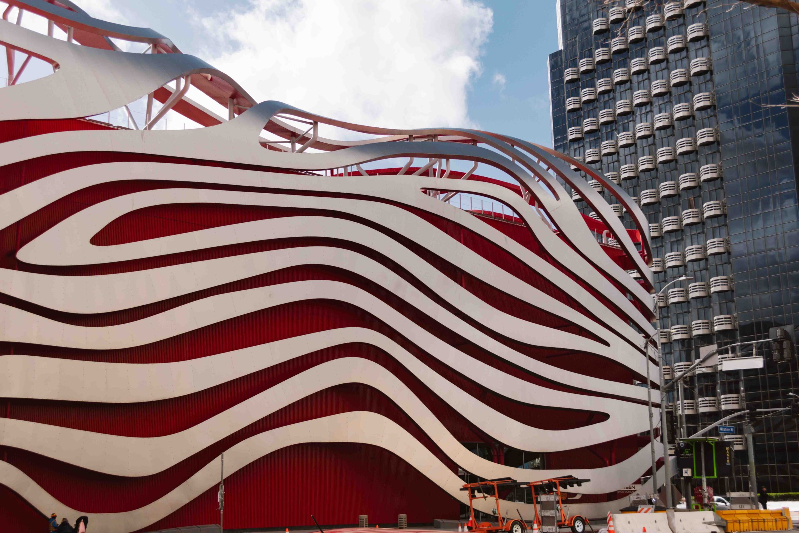 red building with silver wave metal pieces on the exterior