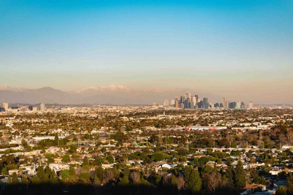 View of Los Angeles skyline with snowy mountains in the background