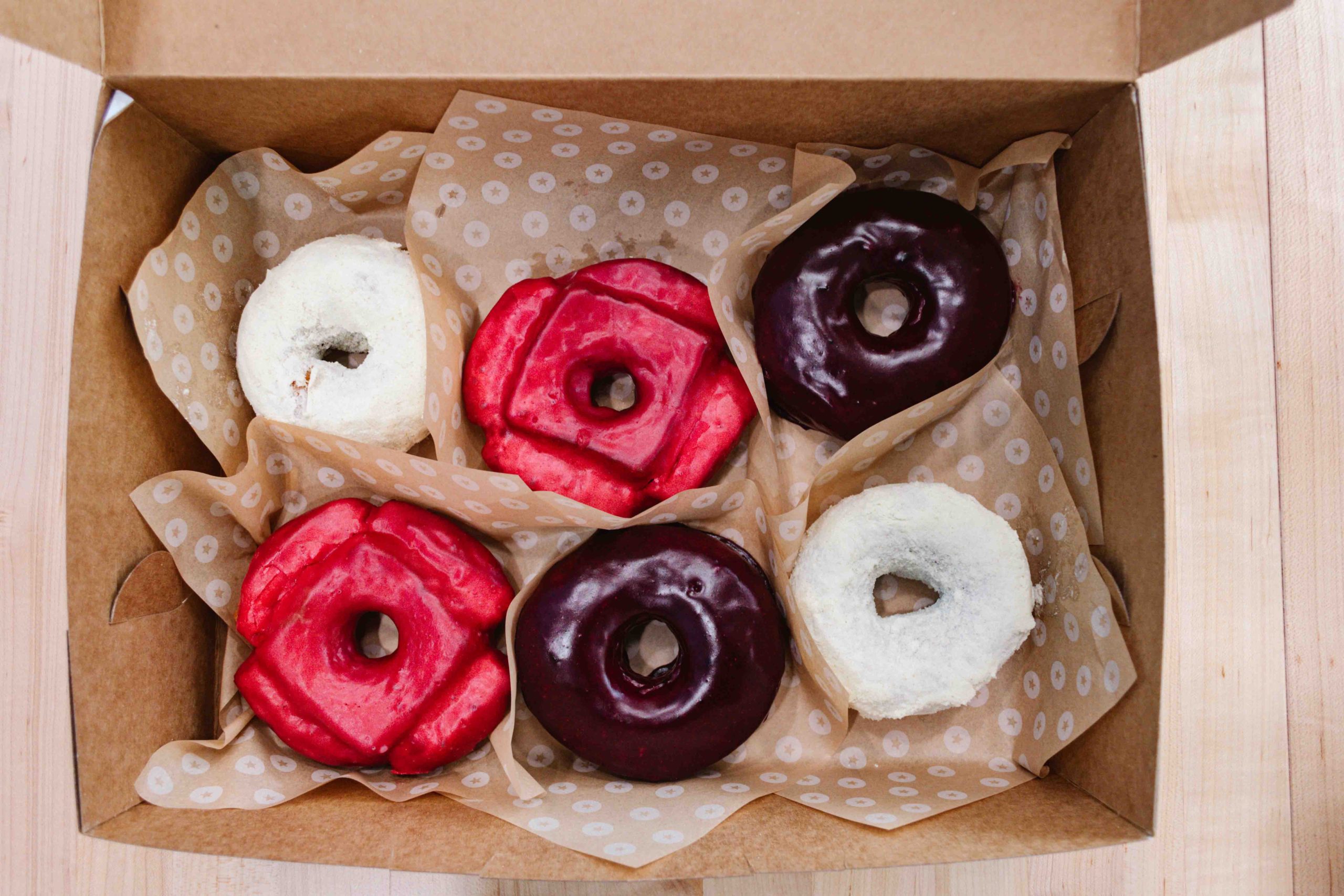 Donut box of 6 donuts, 2 of 3 flavors each.