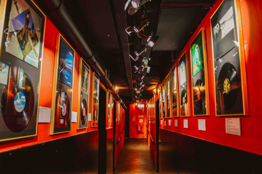 Gold and platinum records on red walls in Dublin's Irish Rock n Roll Museum Experience