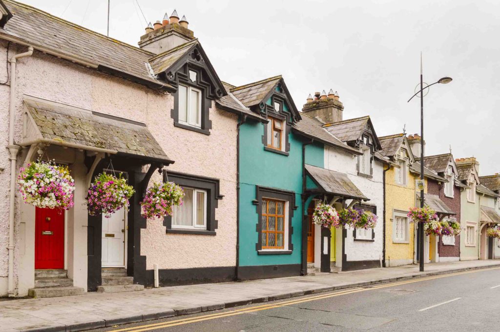 rows of colorful homes in Ireland on a cloudy day