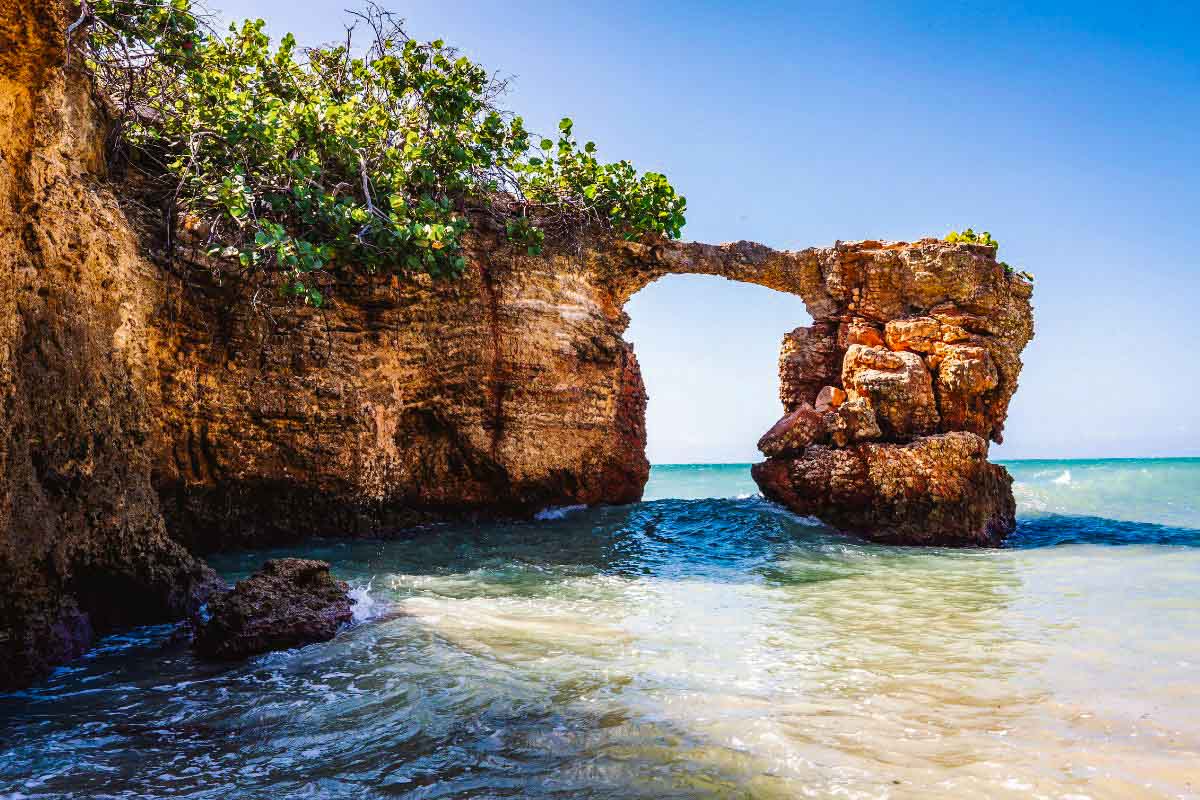 rock arch on a beach side cliff
