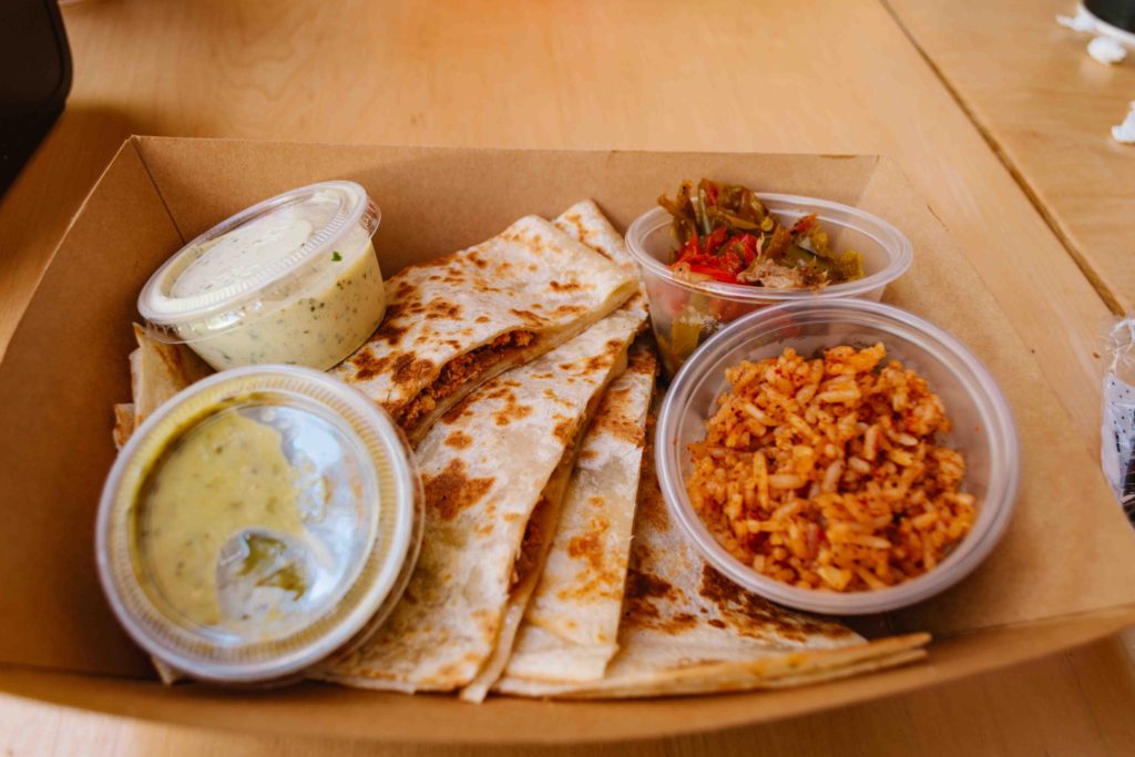 The Creamery Marketplace restaurants include Quesadilla Gorilla where a soyrizo quesadilla is shown with sides of two salsas, rice and beans