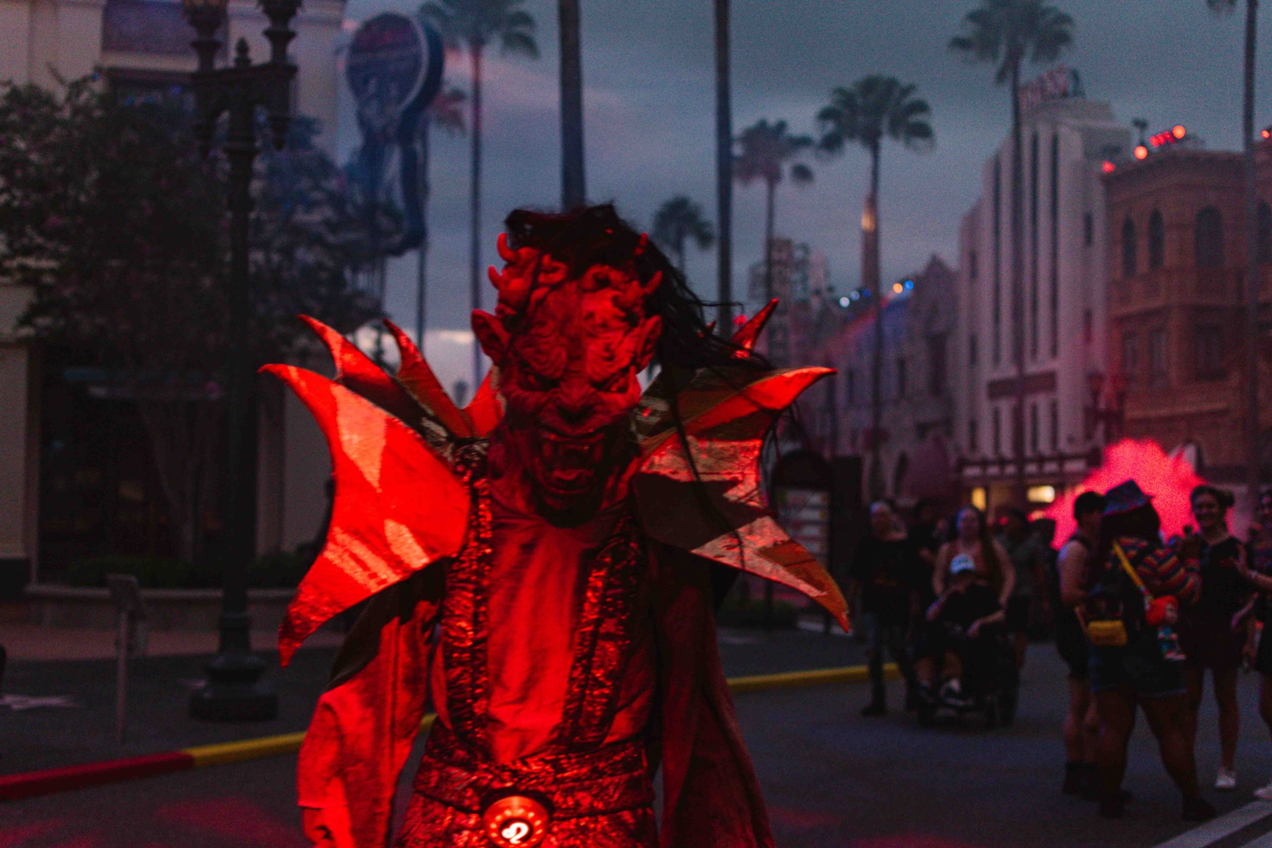 Man in a monster costume scaring the camera person.