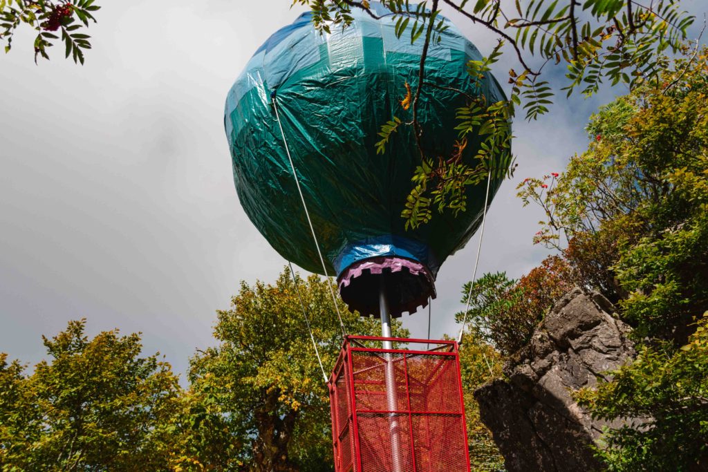 Hot air balloon metal ride in Oz amusement park covered in a safety tarp