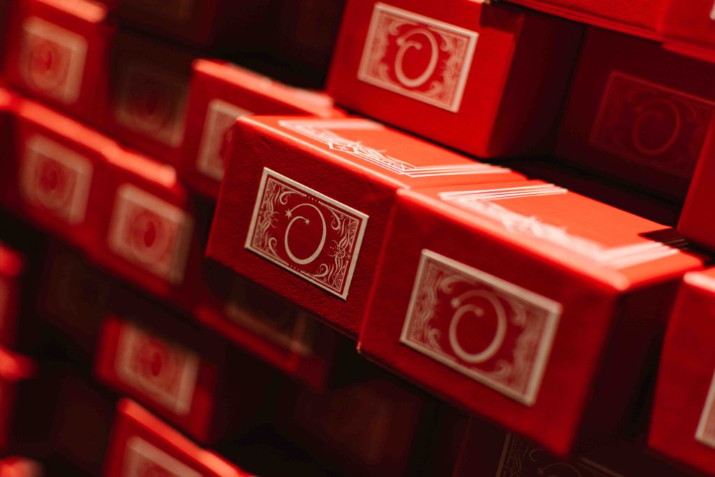 Shelf of red boxes that house Harry Potter interactive wands
