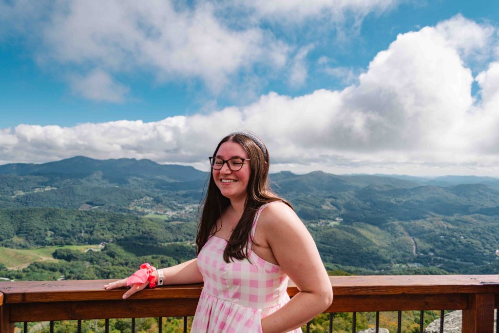Woman in pink admiring the North Carolina mountains