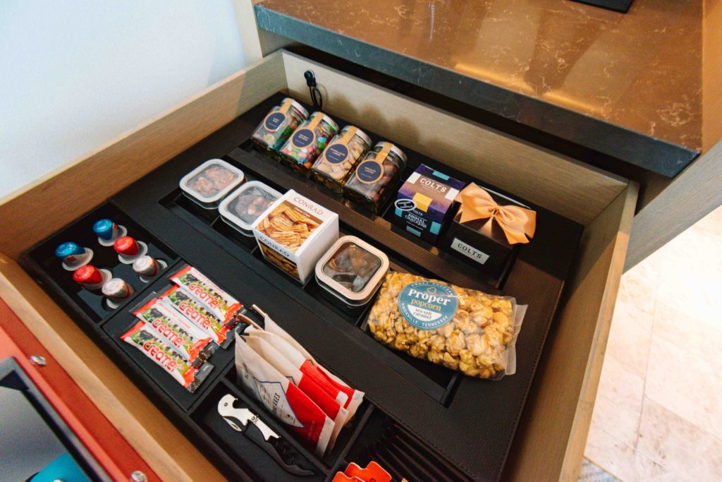 Drawer of locally sourced snacks in a hotel's kitchenette area; one of the best places to stay in Nashville
