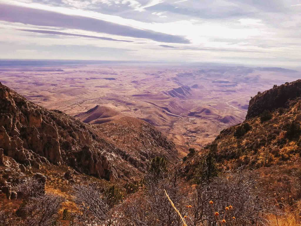 View of Guadalupe Mountains National Park from atop a mountain peak in mid day in spring