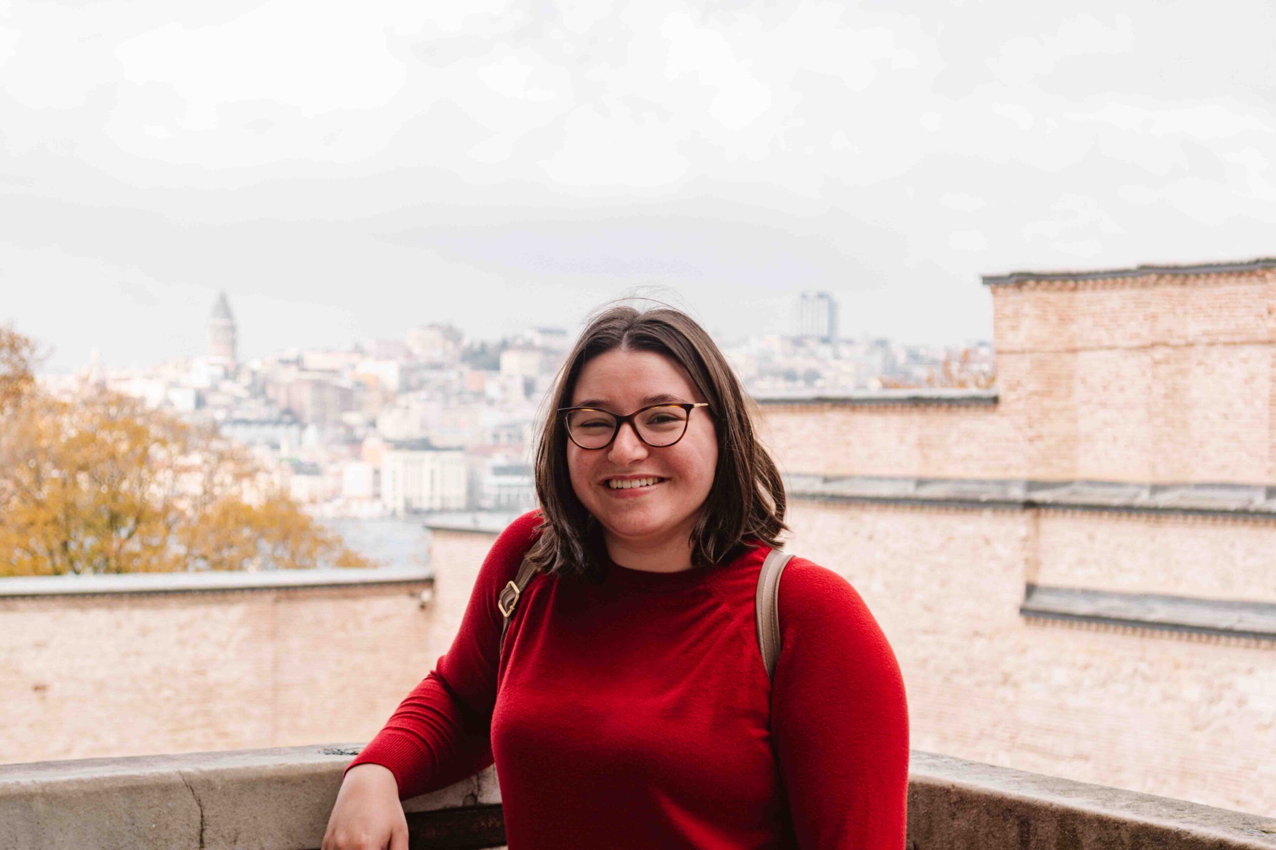 Woman standing at a viewpoint in Istanbul where you can see the Galata Tower