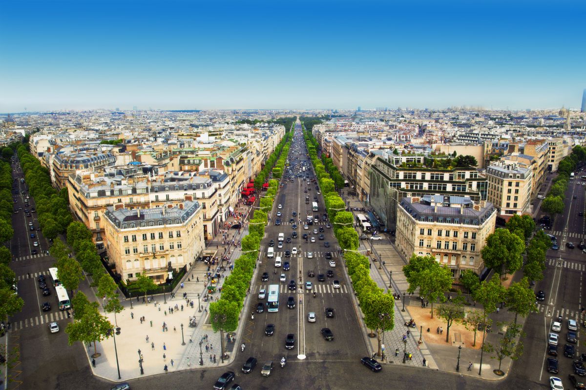 Arc de Triomphe rooftop view of Champs Elysées during daylight on a sunny clear day