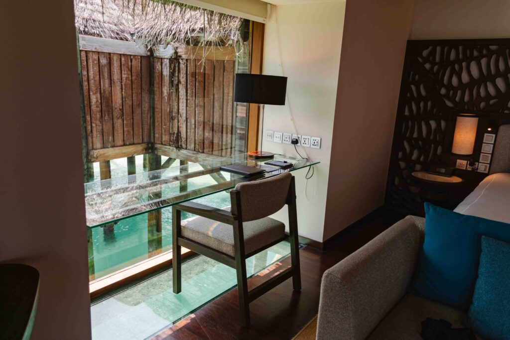 Ocean views from glass bottom floor in Maldives overwater bungalow
