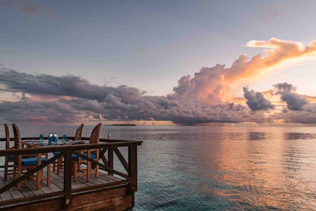 restaurant along the ocean during sunset