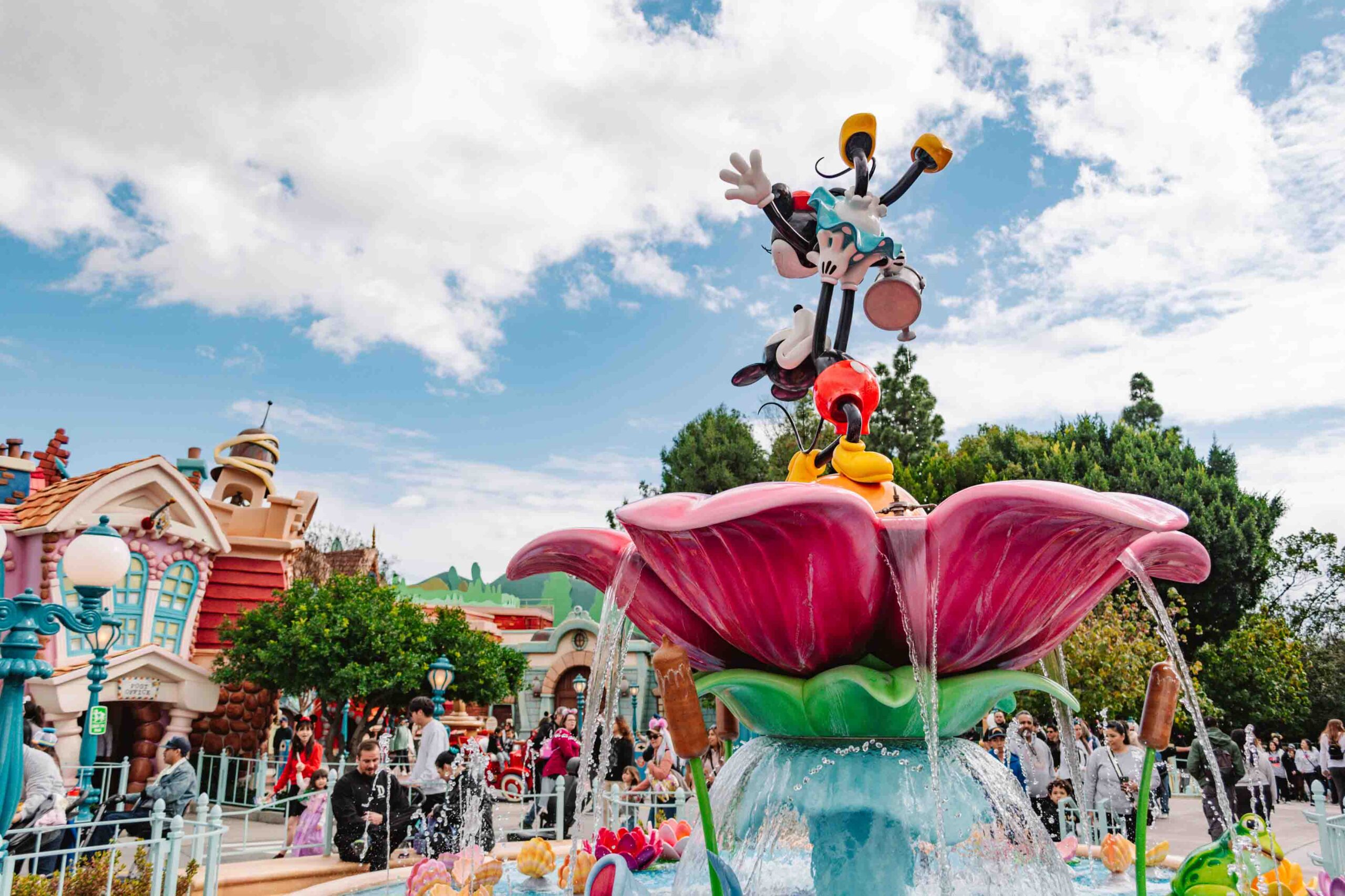 New toontown renovation with Mickey and Minnie fountain and cartoon buildings in the background