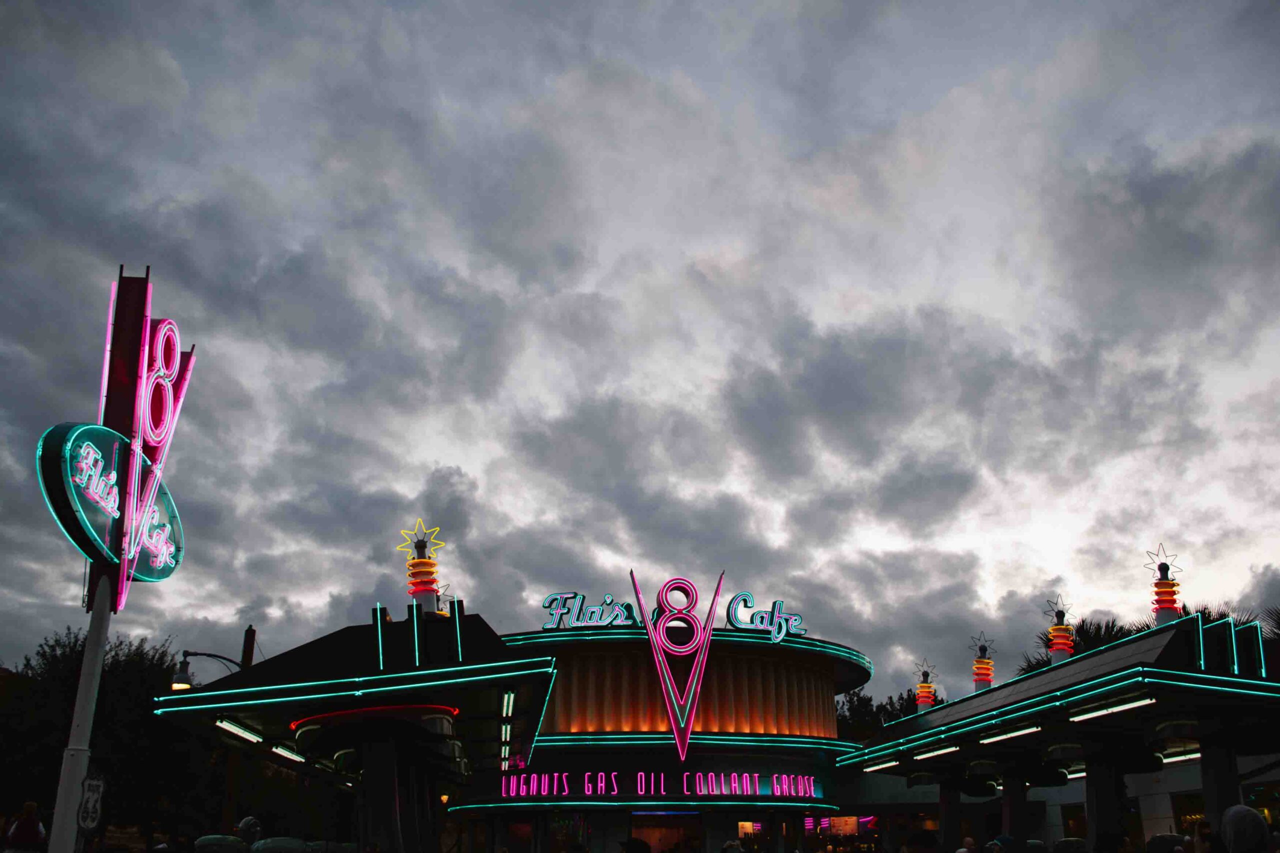 Flo's Cafe in Carsland with the neon turned on on a cloudy day, one of the most unique Disneyland Resort experiences