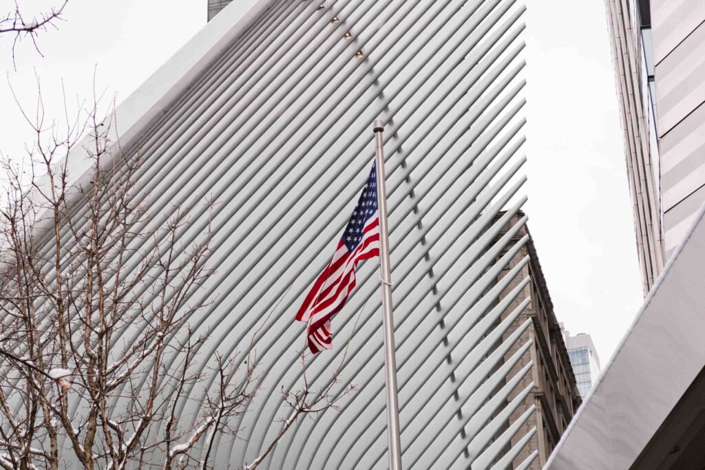 Exterior of 9/11 Memorial Museum with the American flag waving