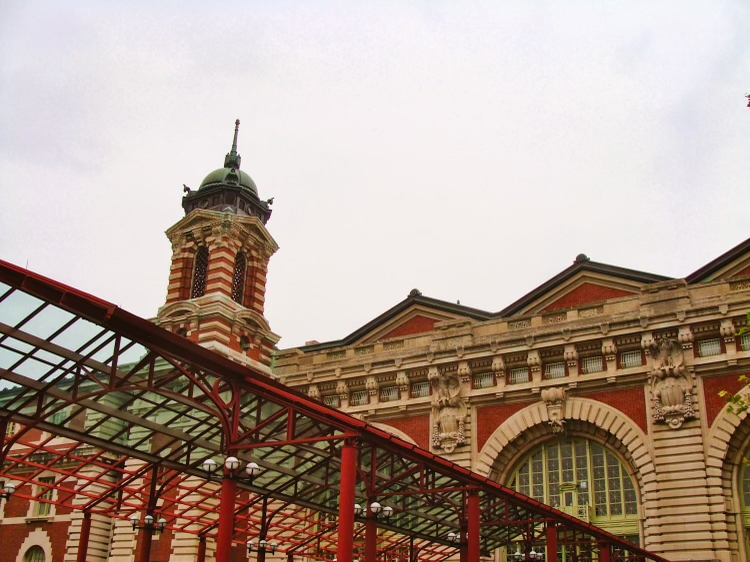Exterior of Ellis Island Museum of Immigration on a cloudy summer day