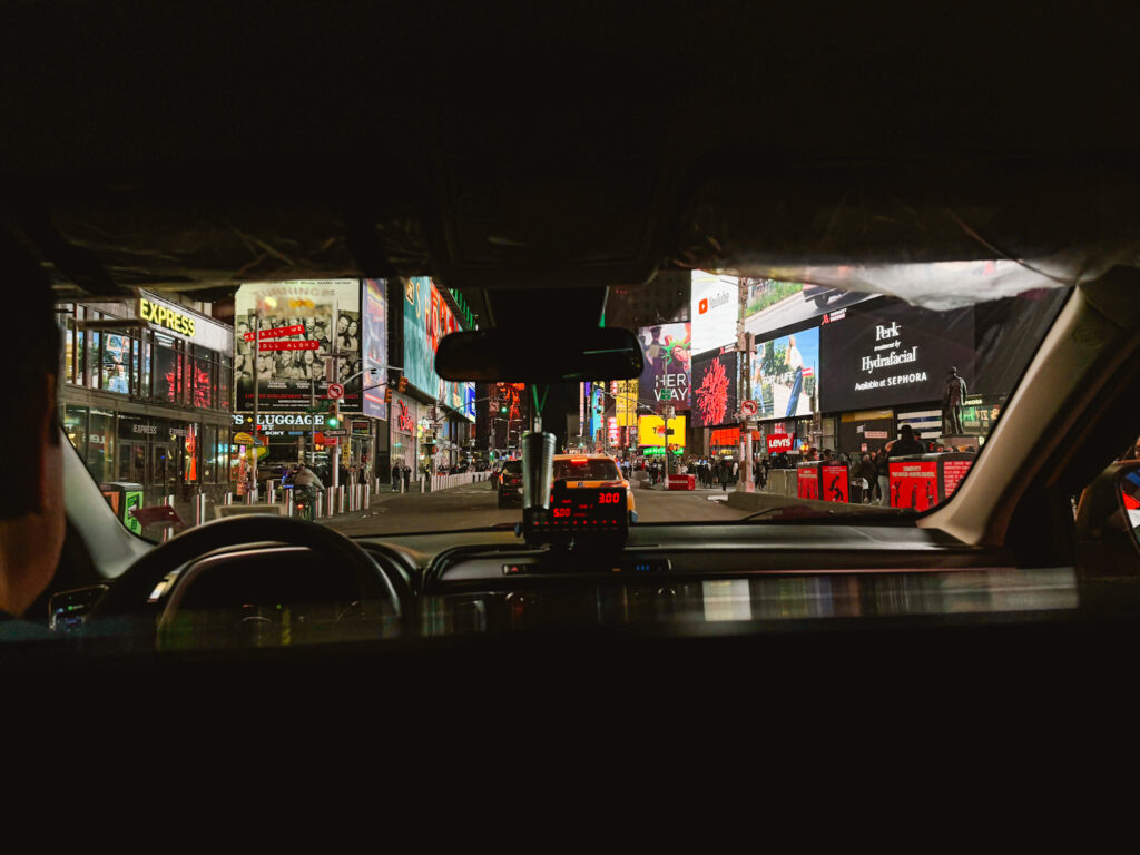 New York City taxi view looking out from the inside of the taxi looking at Times Square
