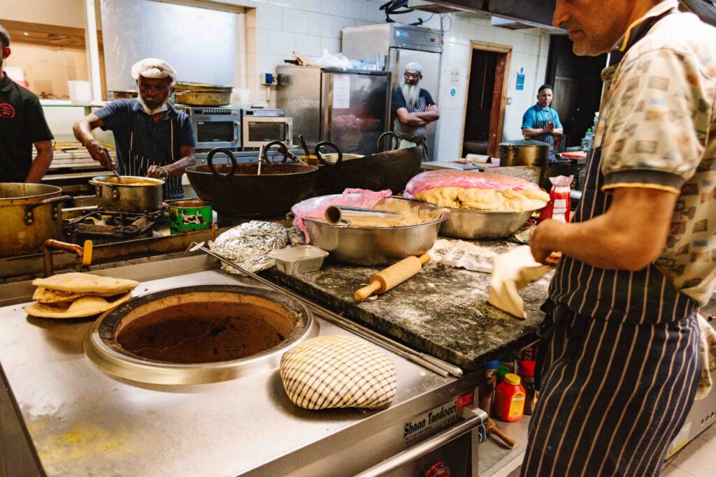 Behind the scenes at an Indian restaurant in London as part of an Indian food tour with Secret Food Tours