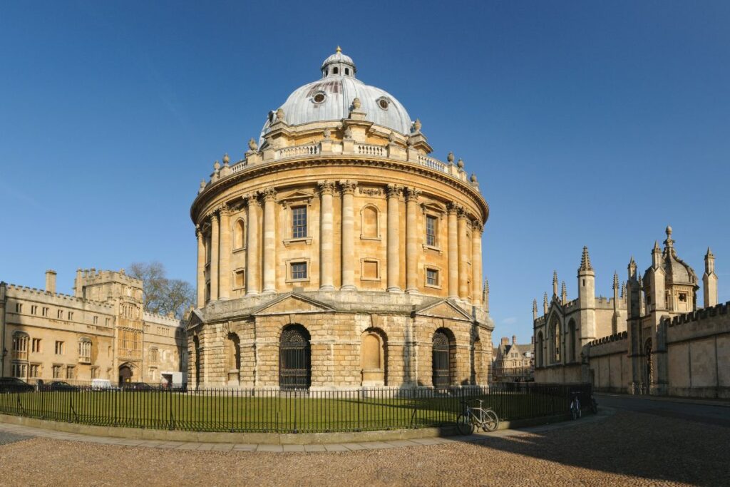 Exterior view of Radcliffe Camera building at Oxford University at sunset golden hour