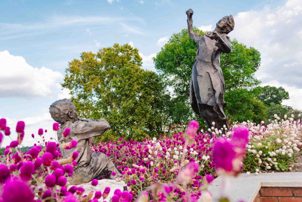 The Augusta Sculpture Trail features over 15 sculptures throughout the city including the one shown here, Maestro which has a conductor leading a young boy playing the flute