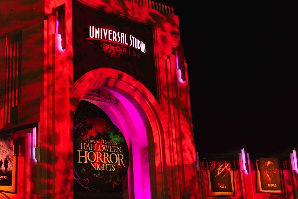 Halloween Horror Nights Orlando archway with signs for each house