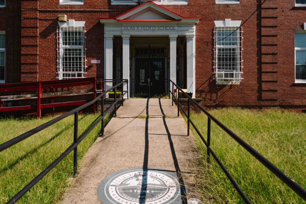 View of the exterior of James Brown's elementary school, seen as part of the James Brown Family Historical Tour
