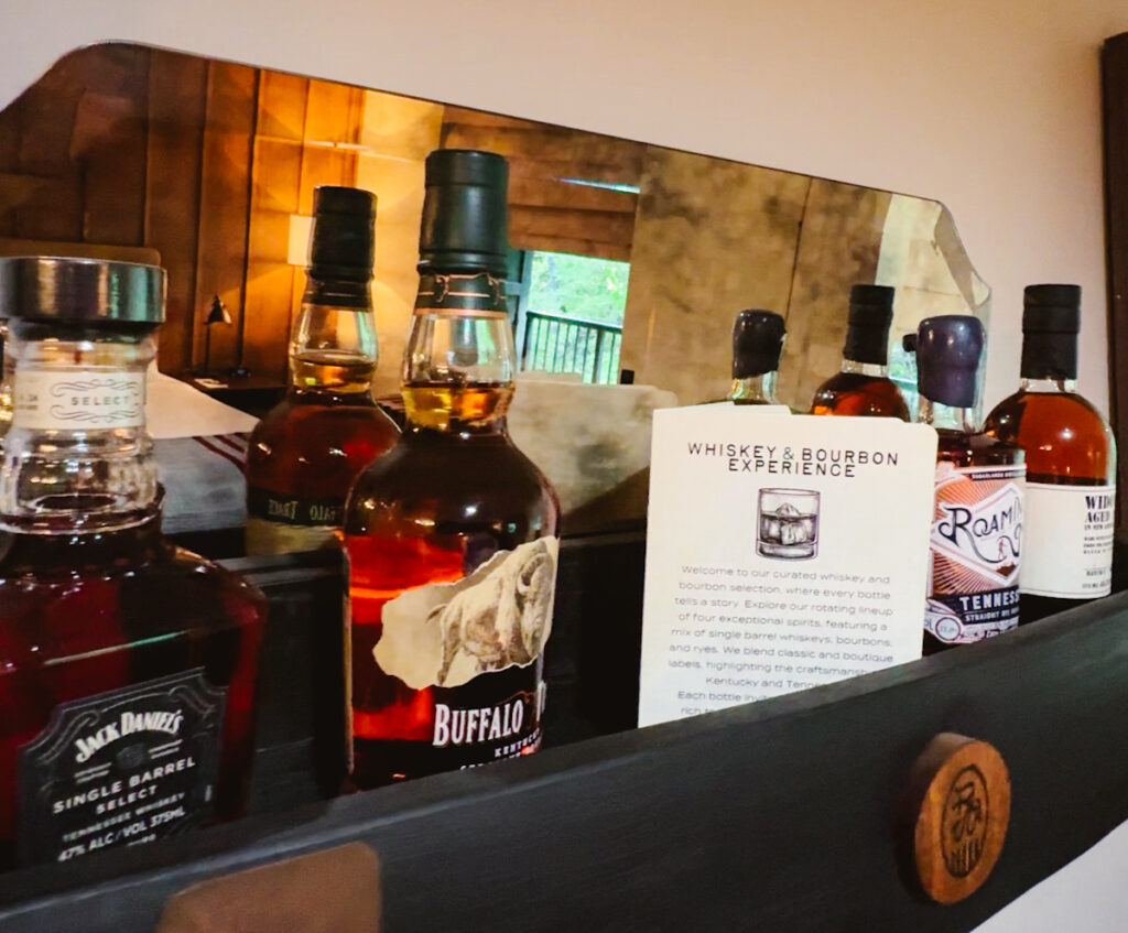 Rocky Waters Inn in Gatlinburg has Tennessee whiskies for sale as shown here with Jack Daniels, Roaming Man, and more.