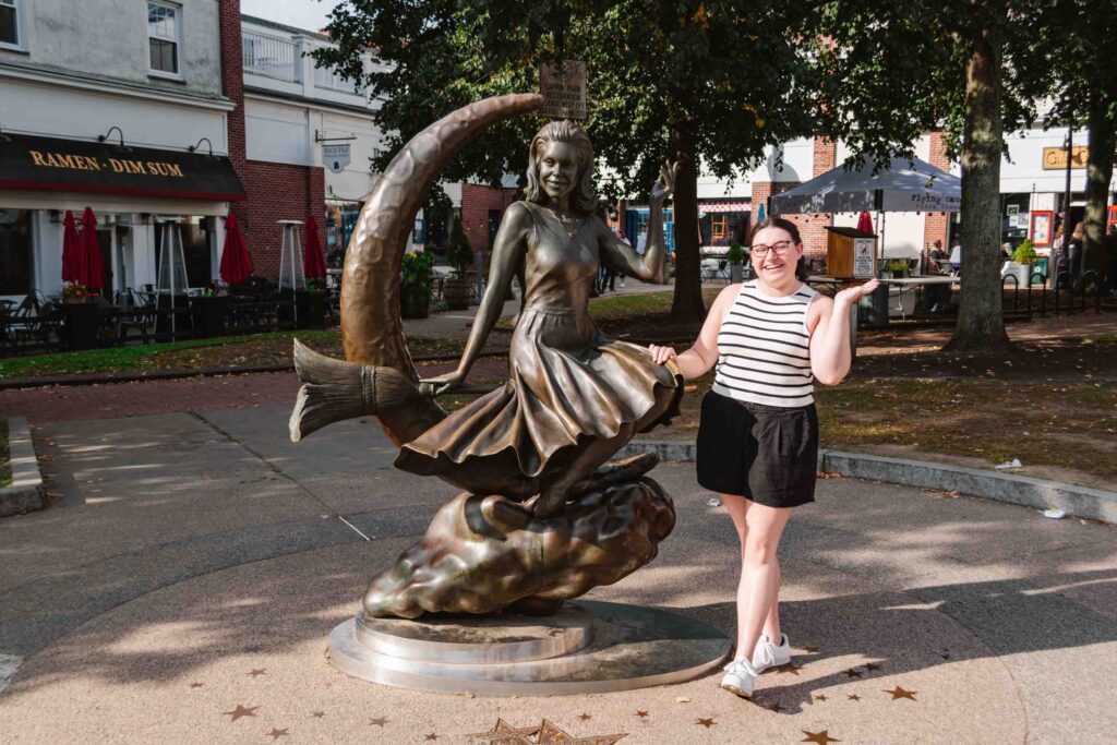 Posing to the side of the Bewitched Statue in Salem MA