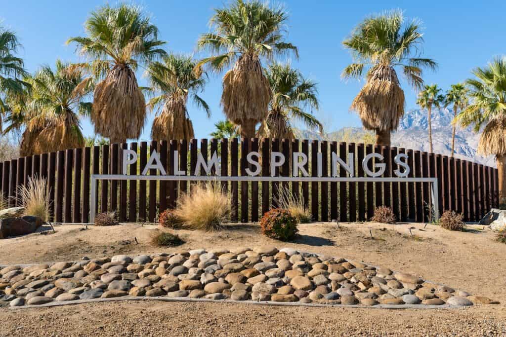 Sign for Palm Springs along the Gene Autry Trail on a sunny day