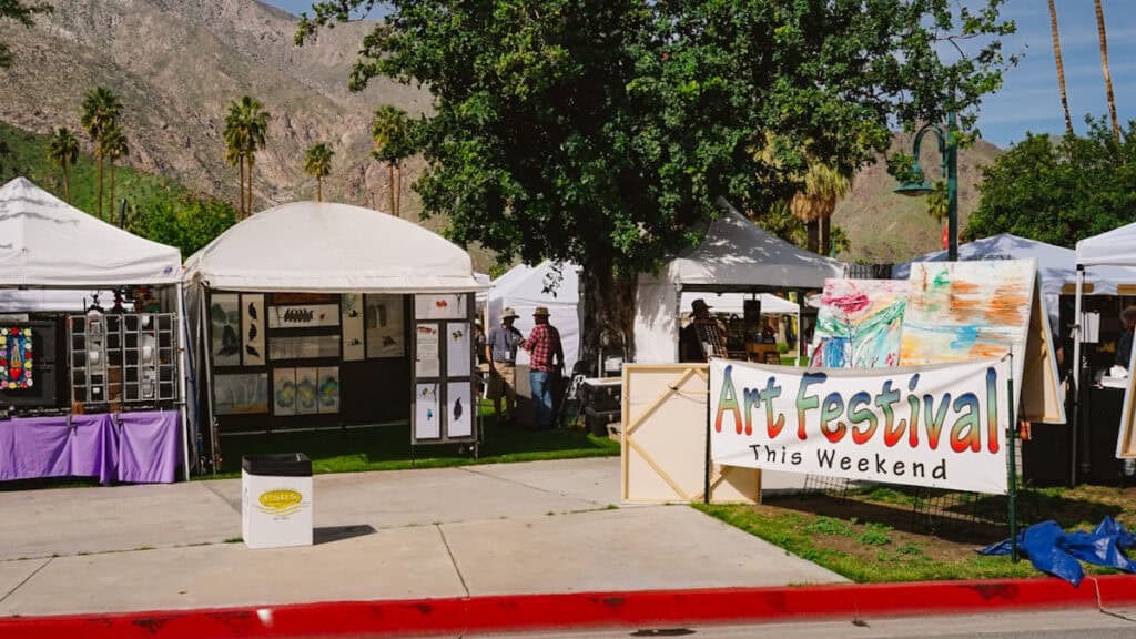 Palm Springs Arts Festival in a park with a desert mountain in the background