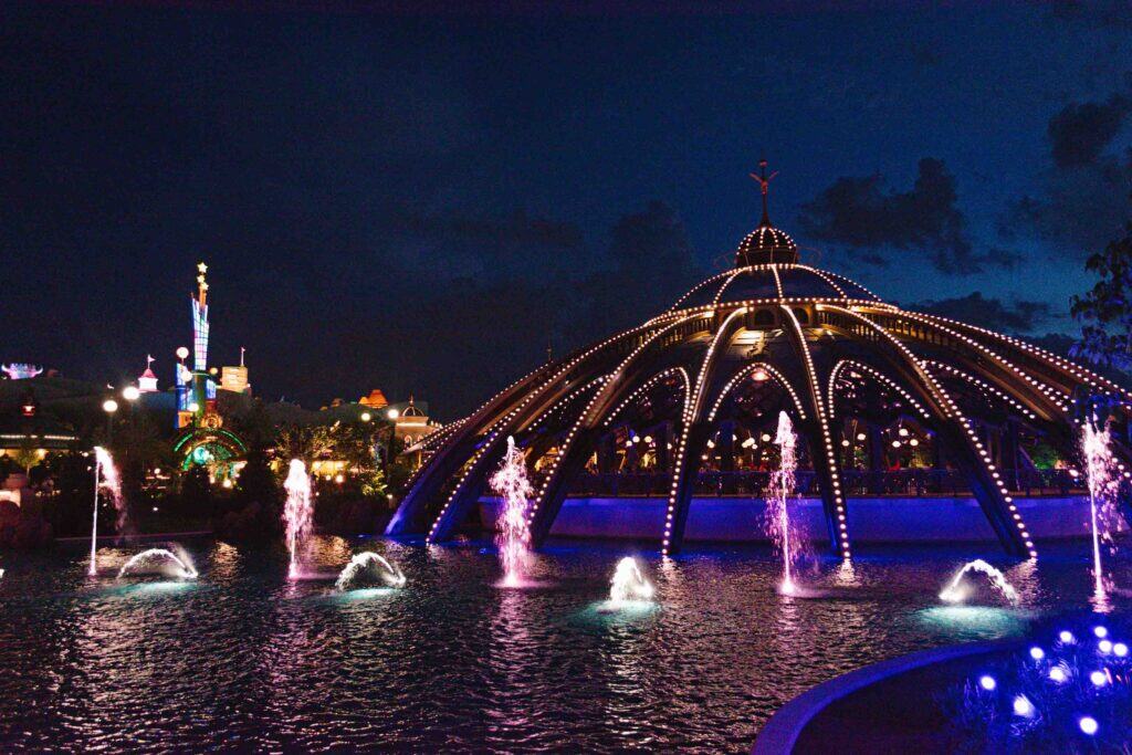 Celestial Park at night in Epic Universe showing the fountain show