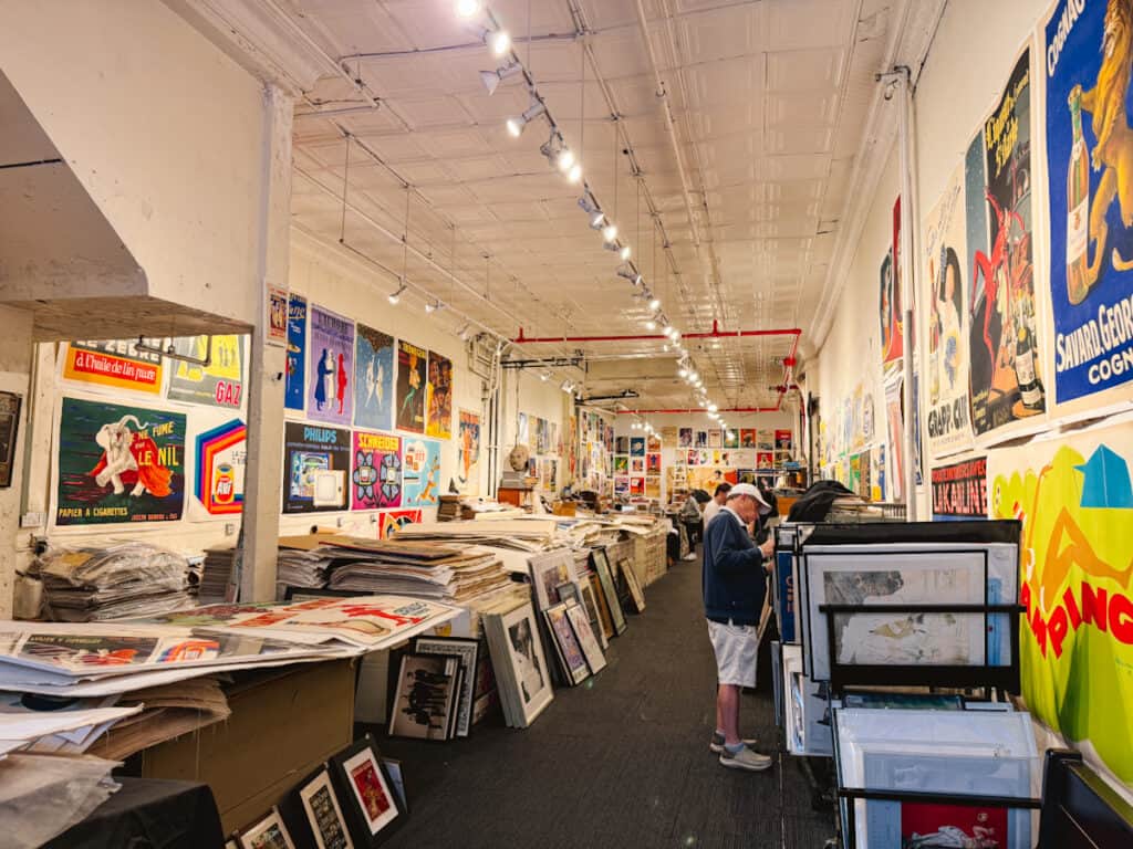 Interior view of Philip William Posters in Tribeca New York, which is part museum of vintage posters, and part shop of prints.
