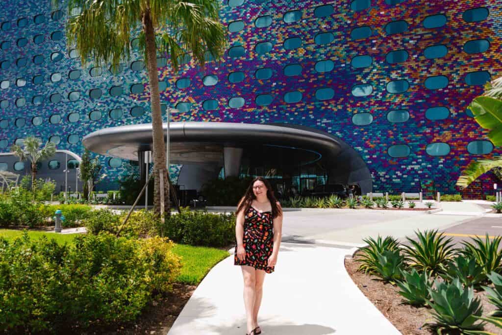 Epic Universe hotel called Stella Nova with rainbow multicolored tile on the exterior giving the building purple, blue, and red shades