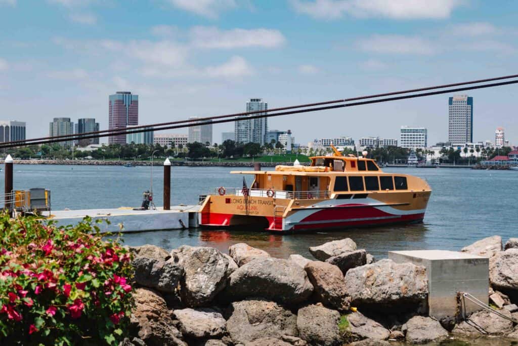 Long Beach harbor ferry ride called the AquaLink, a red and orange ship