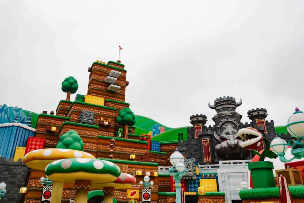 View from the ground floor of Super Nintendo World on a cloudy day in Los Angeles