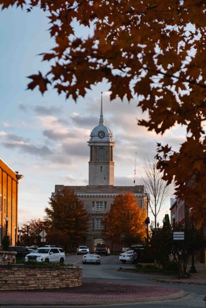 Columbia TN during autumn with orange trees and the courthouse in the background perfectly framed by leaves