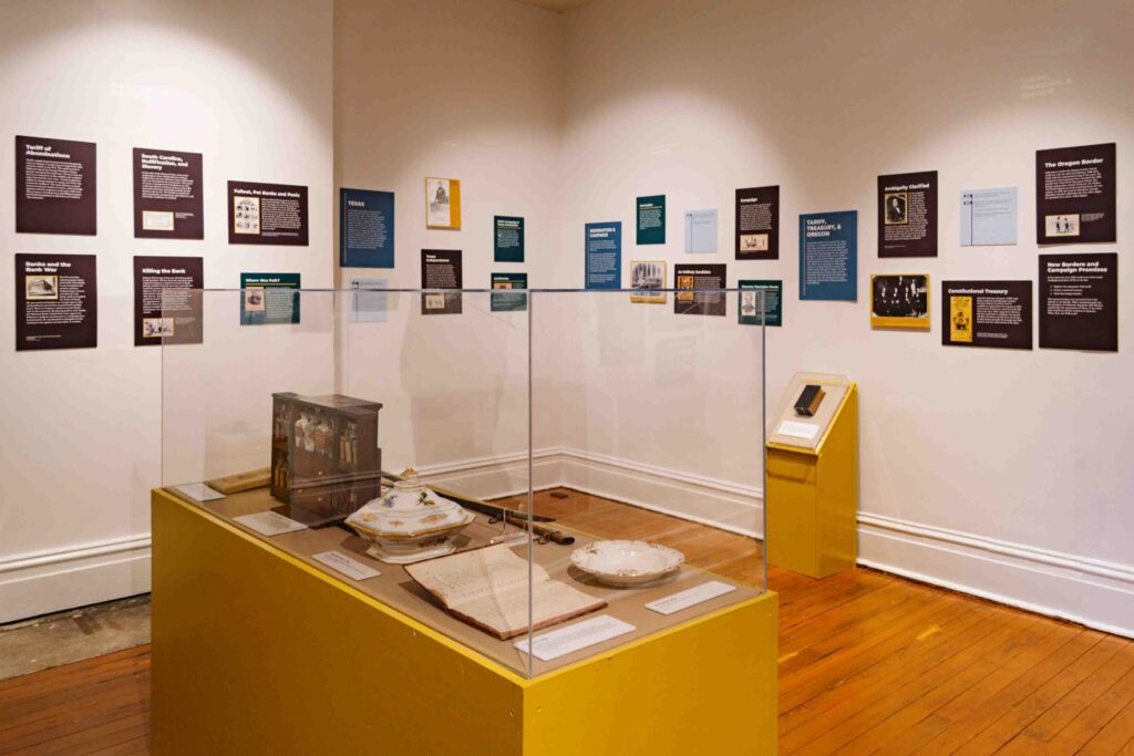 Inside the President James K Polk museum where there are artifacts and historic timelines on the wall